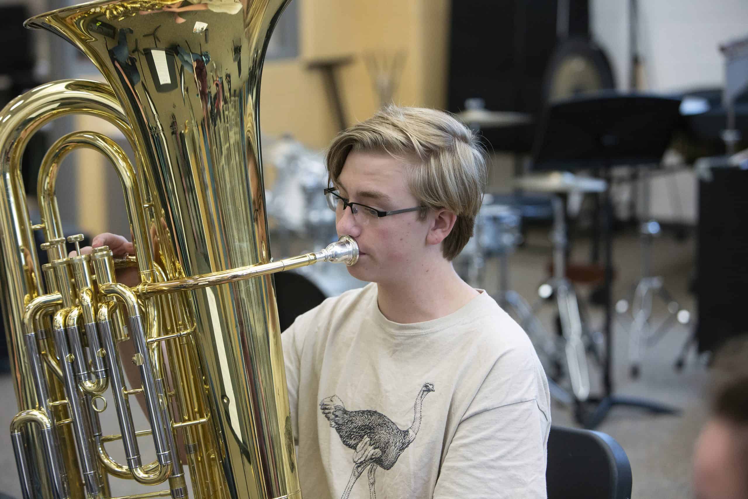 Male student playing the tuba